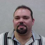 clay-buckner-crop-u3715-150x150 Clay Buckner headshot wearing a striped polo shirt with a neutral background