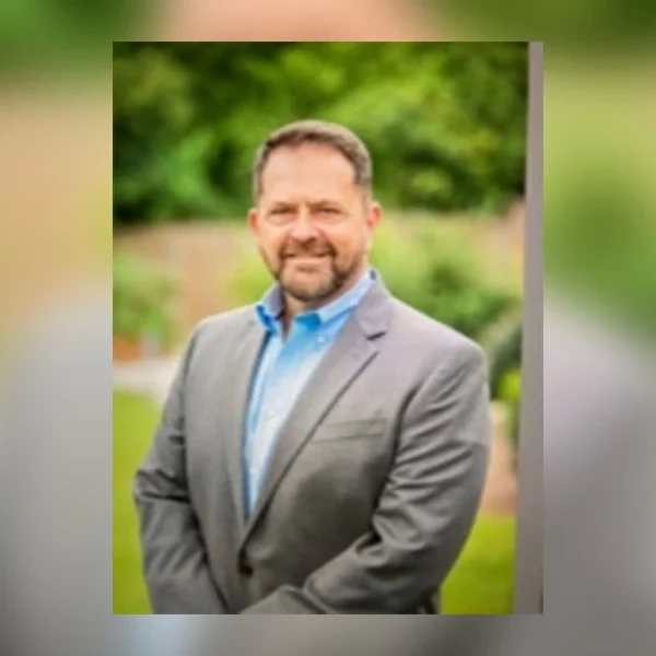 Attorney Steve Law in a suit outdoors, representing trusted legal counsel and client advocacy